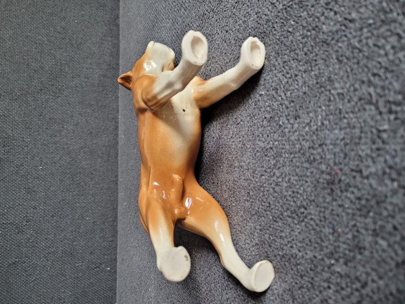 Vintage porcelain figurine of a boxer dog