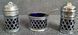 A vintage set of salt and pepper shakers and mustard dish made in England