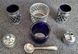 A vintage set of salt and pepper shakers and mustard dish made in England