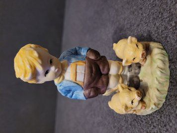 Figurine Boy with pigs.
