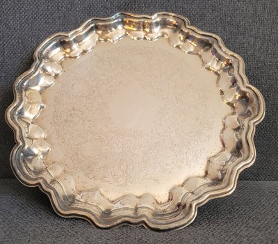 Vintage round silver-plated tray with beautiful engraving.