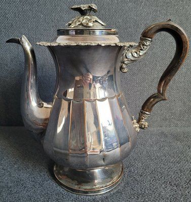 An antique silver-plated coffee pot from the middle of the 19th century.