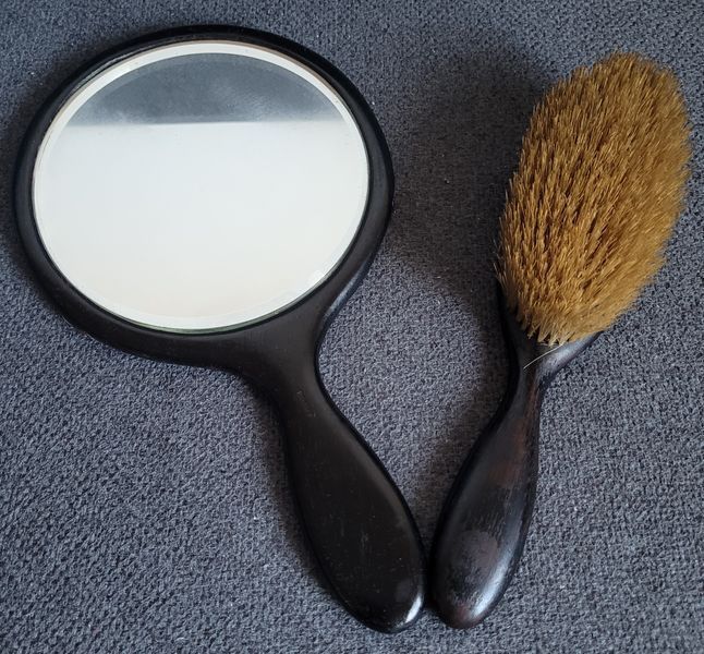 A beautiful set of mirror and combs made of ebony, with sterling silver decoration