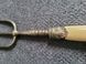 Antique serving fork on a stand