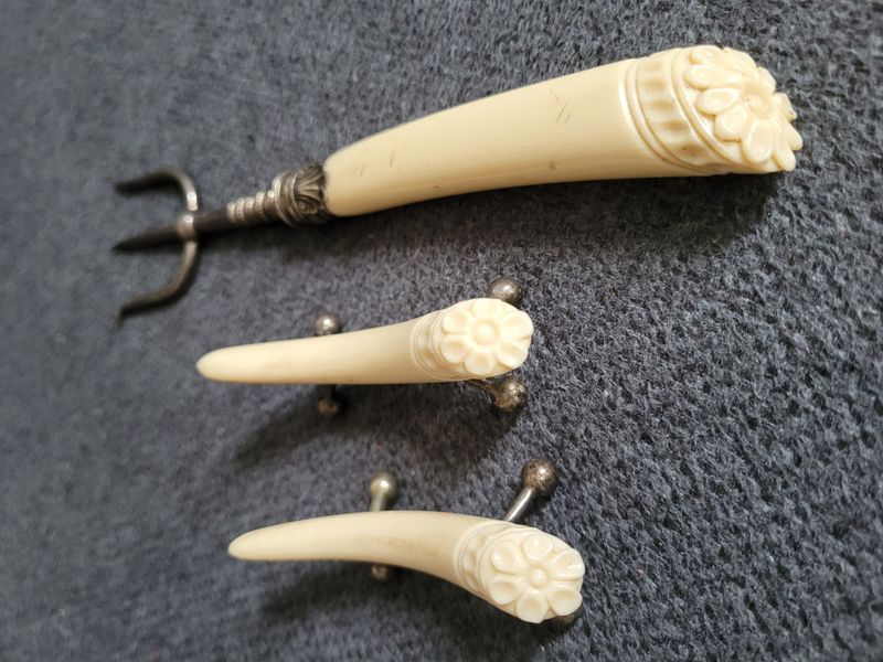 Antique serving fork on a stand
