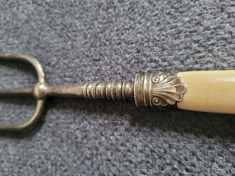Antique serving fork on a stand
