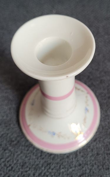 A pair of pink candlesticks made of French porcelain