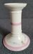 A pair of pink candlesticks made of French porcelain