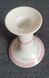 A pair of pink candlesticks made of French porcelain