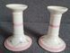 A pair of pink candlesticks made of French porcelain