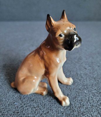 Vintage porcelain figurine of a boxer dog