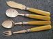 Antique silver-plated serving utensils with a silver rim