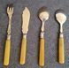 Antique silver-plated serving utensils with a silver rim