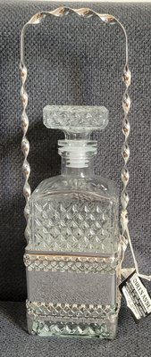 Queen Anne glass whisky decanter with a silver plated frame