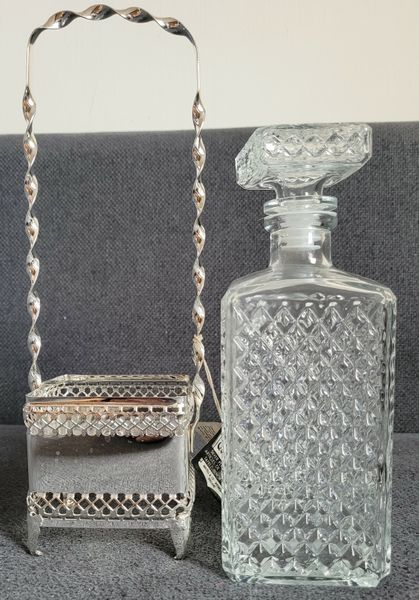 Queen Anne glass whisky decanter with a silver plated frame