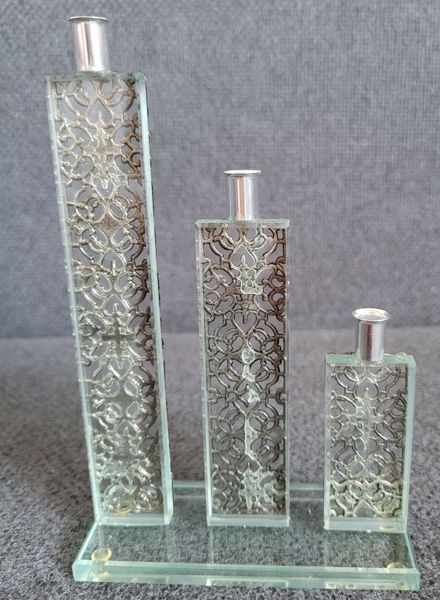 Vintage glass decor with metal filigree.