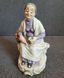 Figura vintage de cer&aacute;mica Ardco &laquo;Mujer mayor con cesta de frutas&raquo; Jap&oacute;n