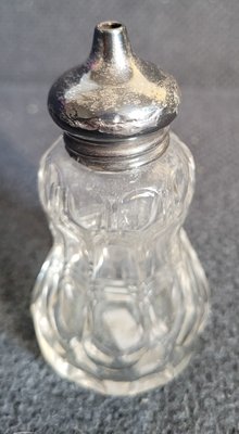Antique crystal pepper shaker with sterling silver top,