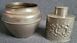 Vintage white metal sugar bowl and tea storage bottle.