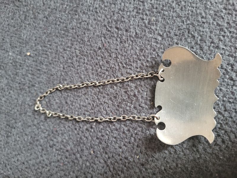 Two vintage silver labels for a decanter with a chain.