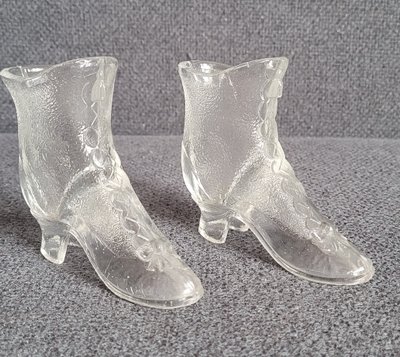 A pair of vintage glass boots