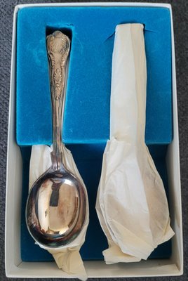 Brand new silver-plated soup spoons in their original packaging.