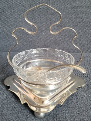 Antique silver-plated English sugar bowl with a round glass insert