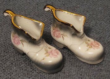 A pair of Mayfayre porcelain shoes