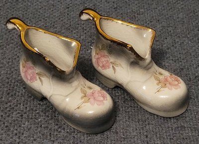 A pair of Mayfayre porcelain shoes