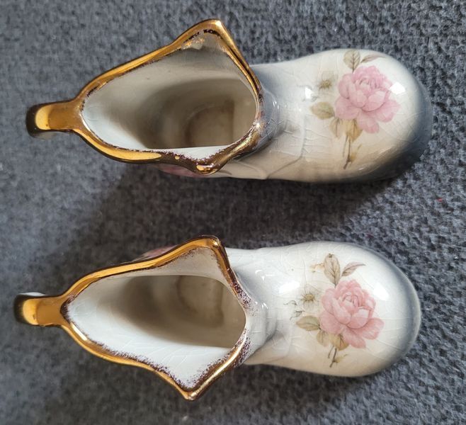 A pair of Mayfayre porcelain shoes