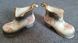A pair of Mayfayre porcelain shoes