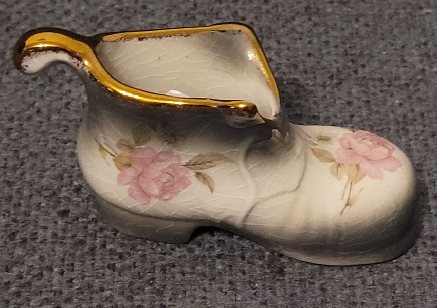 A pair of Mayfayre porcelain shoes
