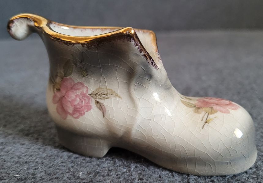 A pair of Mayfayre porcelain shoes
