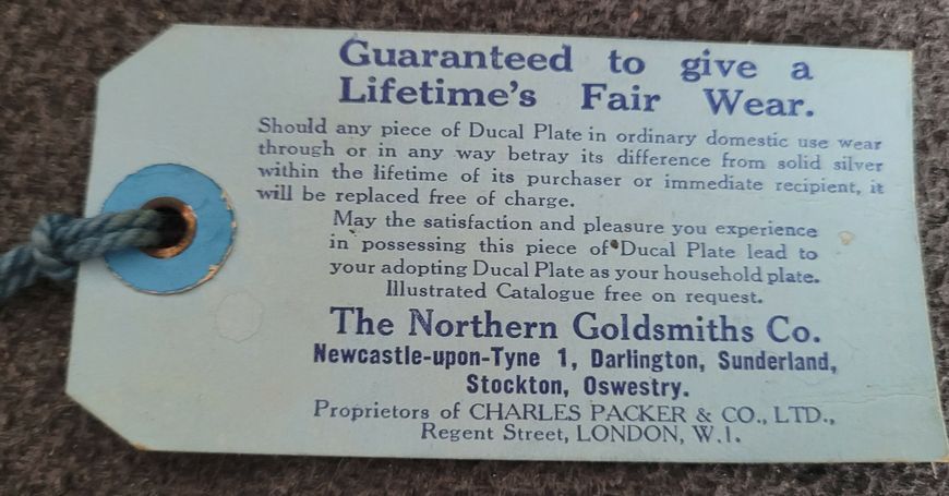 A set Goldsmiths & Silversmiths Co Ltd of antique silver-plated spoons with a large serving spoon