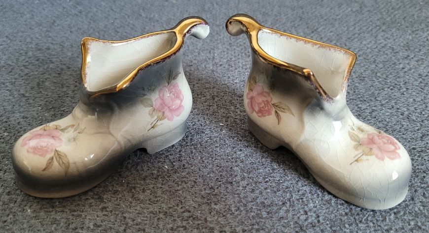 A pair of Mayfayre porcelain shoes