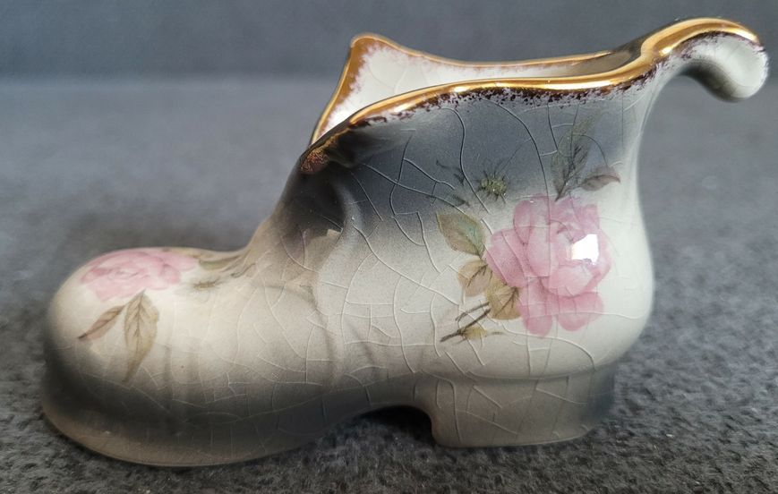 A pair of Mayfayre porcelain shoes