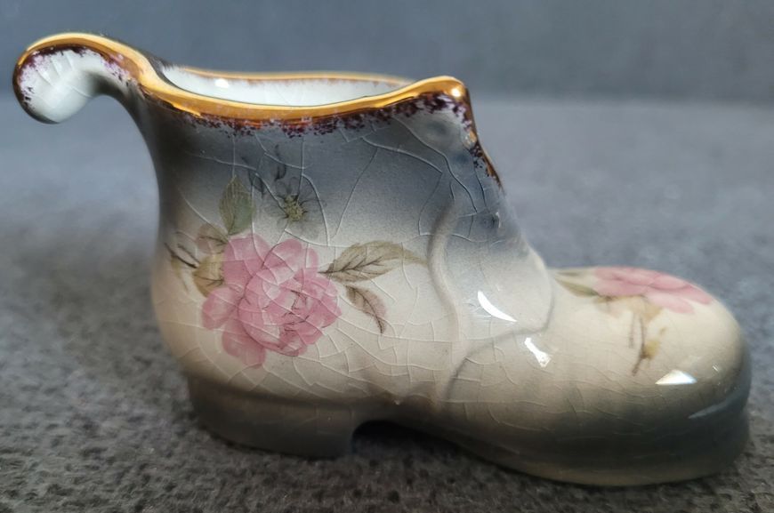 A pair of Mayfayre porcelain shoes