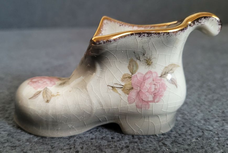 A pair of Mayfayre porcelain shoes