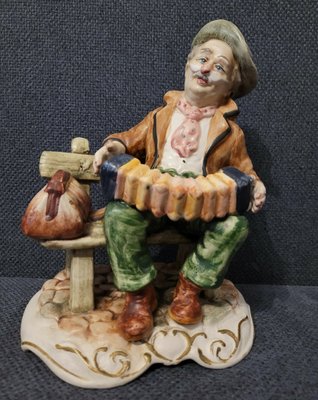 Capodimonte Figurine "Man Tramp On Bench Playing Accordion"