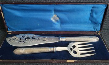 Antique serving set with silver-plated fork and knife