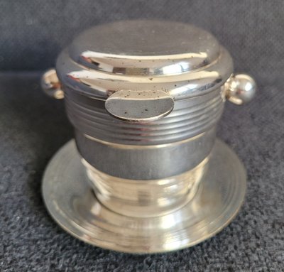 The antique silver-plated tea or coffee filter