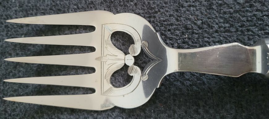 Antique serving set with silver-plated fork and knife