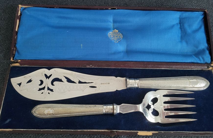 Antique serving set with silver-plated fork and knife
