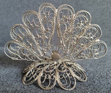 Vintage openwork napkin holder made of white metal.