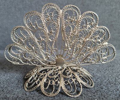 Vintage openwork napkin holder made of white metal.