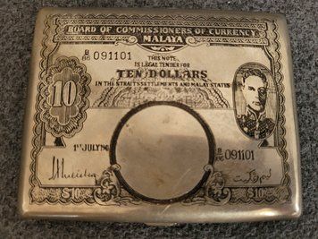Vintage cigarette case  10 dollars with an engraving of King George VI