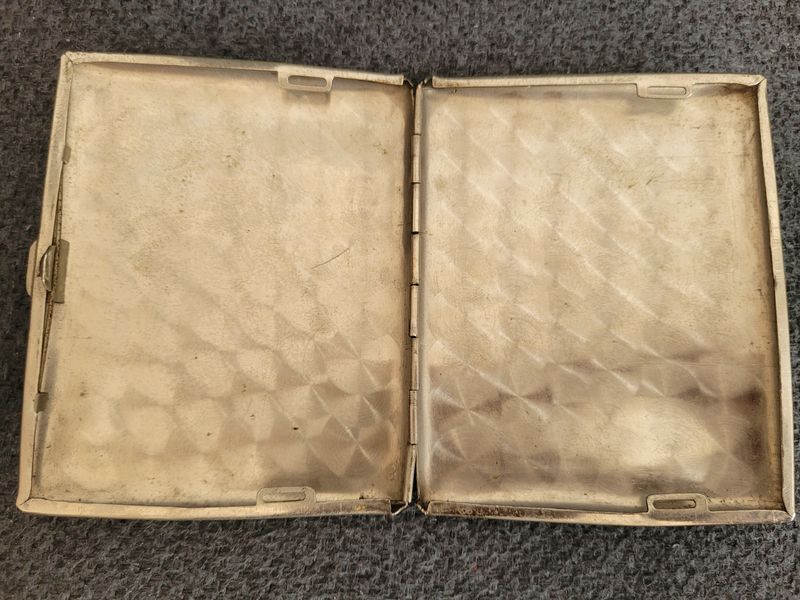 Vintage cigarette case  10 dollars with an engraving of King George VI