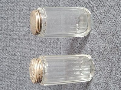 Two antique glass vials with silver lids from 1867 and 1900