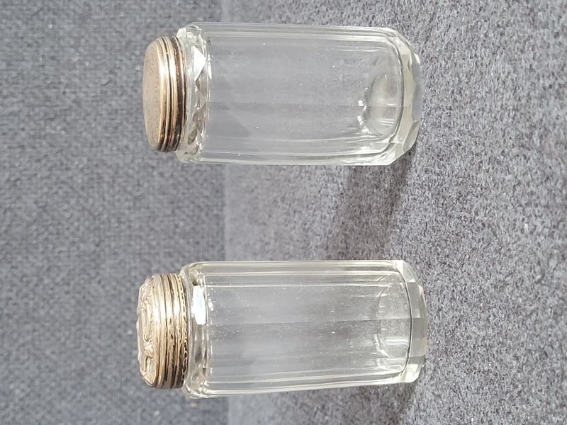 Two antique glass vials with silver lids from 1867 and 1900