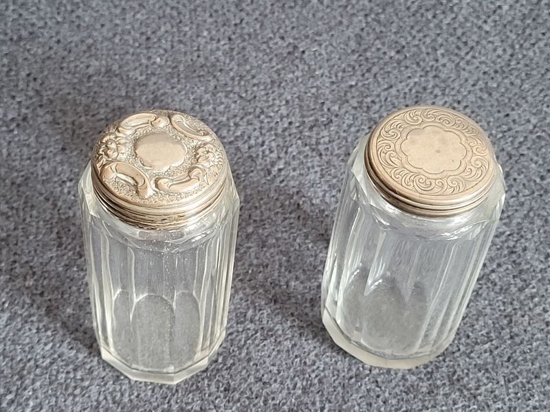 Two antique glass vials with silver lids from 1867 and 1900